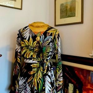 Comfortable flowing fun dress. Easy to wear long sleeves w/button embellishment